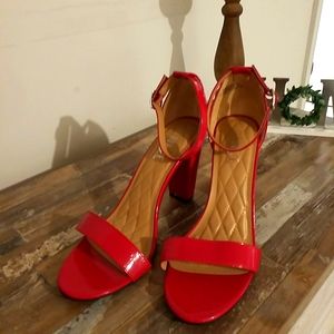 Red sandal pumps